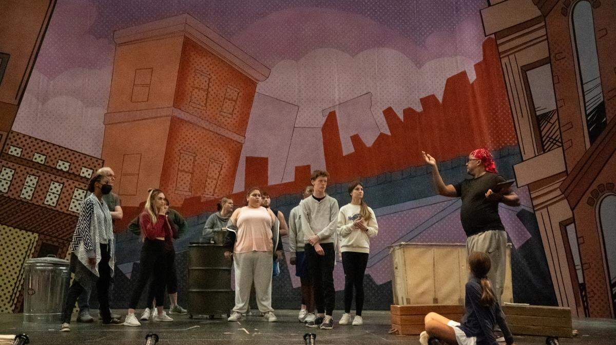Children’s Theatre of Charlotte choreographer Kyle Shawell with actors of “Annie”. The musical runs from Sept. 23 to Oct. 23, and is part of the theater’s 75th anniversary season.