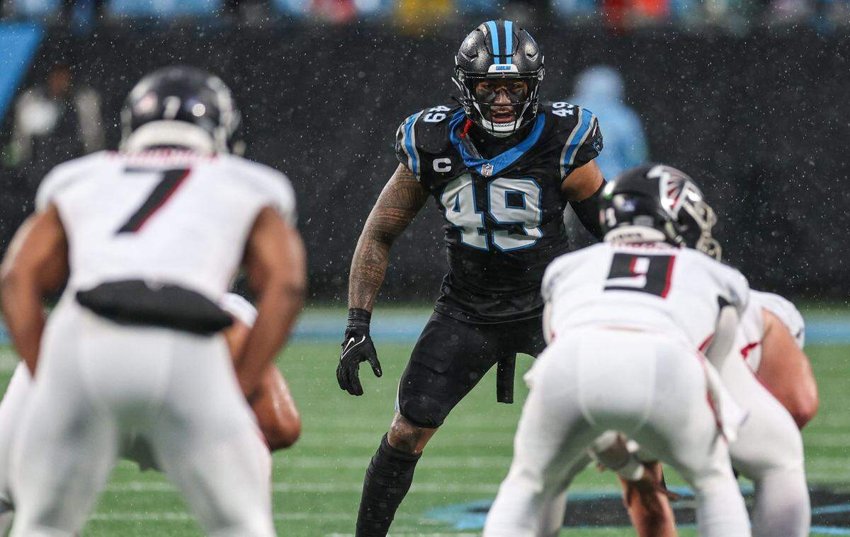 Pantherslinebacker Frankie Luvu (49) eyes the Falcons’ quarterback before the snap during the game at Bank of America Stadium on Sunday, December 16, 2023.
