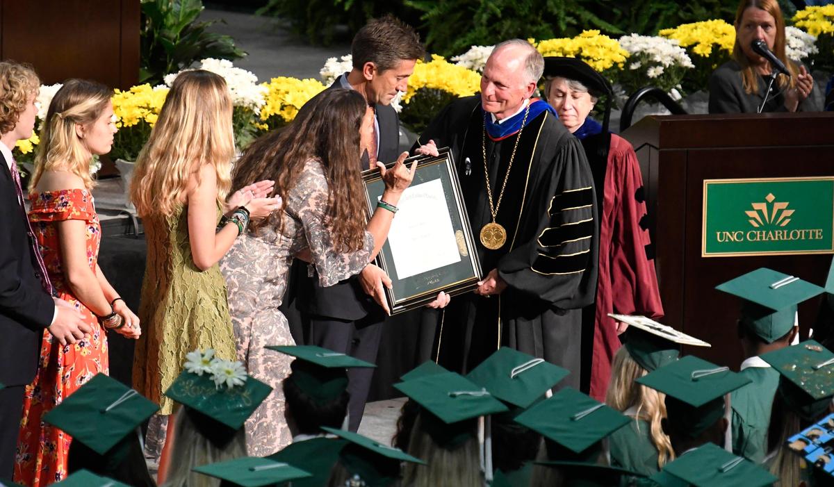 The family of Riley Howell receives his diploma during UNC Charlotte commencement exercises on Saturday, May 11, 2019. Howell died in the UNC Charlotte campus shooting on April 30.