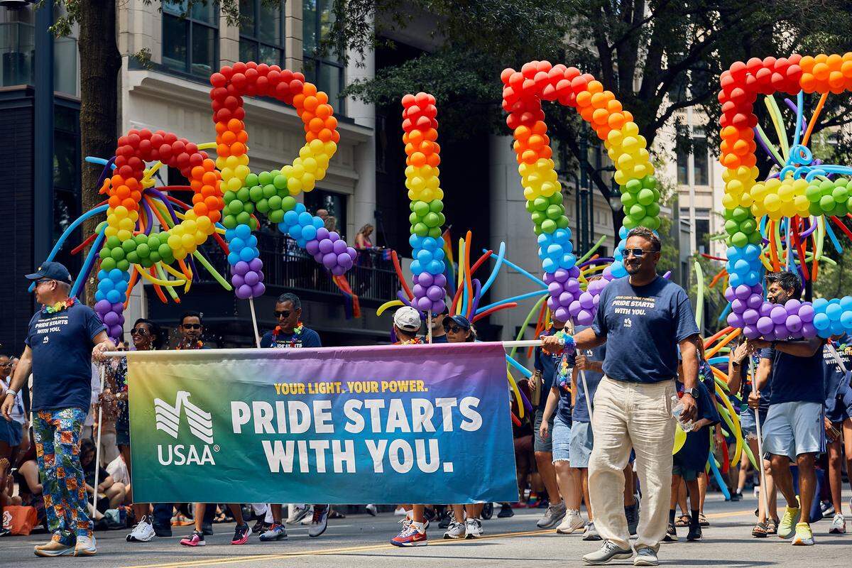 USAA shows their pride with their intricate balloon float during the 25th Charlotte Pride Parade in uptown Charlotte on August 17, 2025.