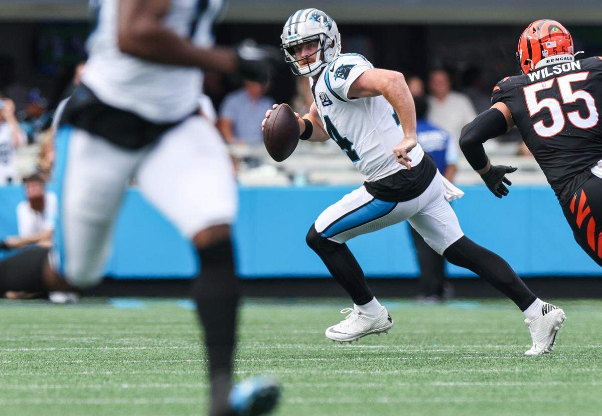 Panthers quarterback Andy Dalton runs with the ball against Cincinnati on Sunday at Bank of America Stadium.