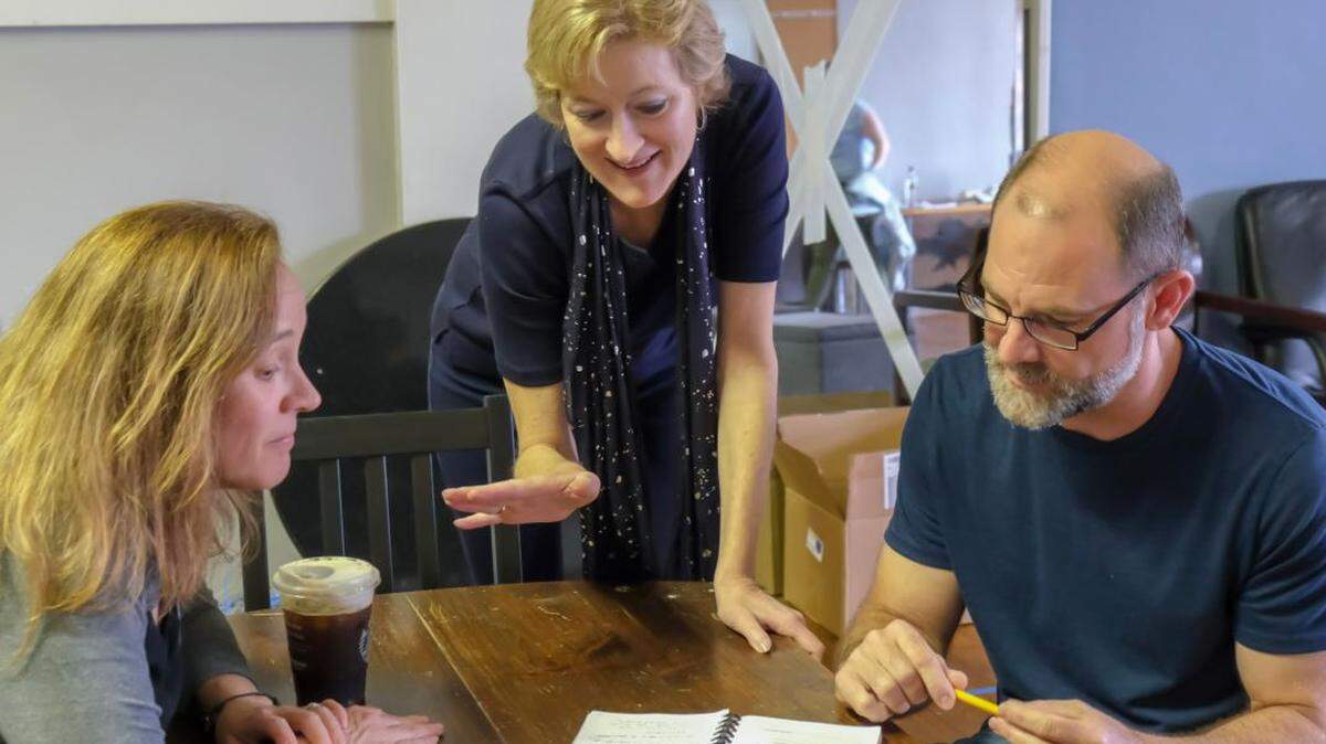 Paige Johnston Thomas, center, worked with actors Tonya Bludsworth and Shawn Halliday on the Tony Award-winning play,  “Oslo,” which she directed last year. Thomas recently died ,and her friends are starting a scholarship fund in her memory that would assist children who want to pursue a theater education. 