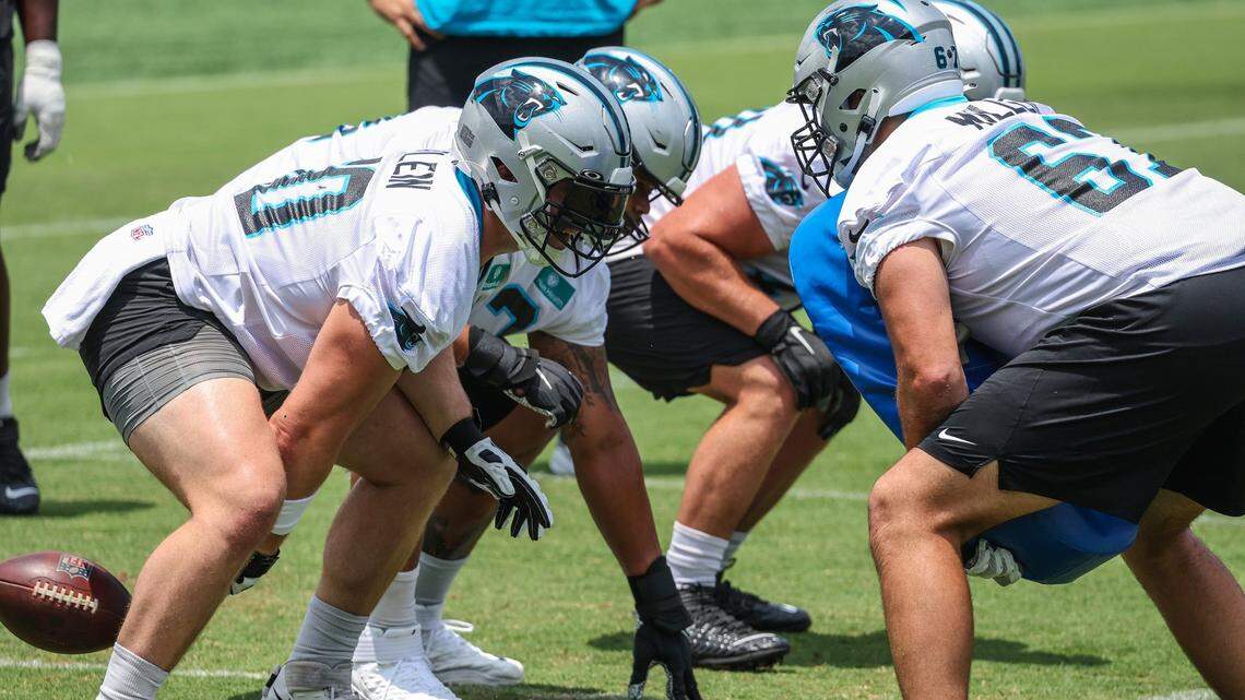 Panthers tguard Pat Elflein, left, hikes the ball during individual position drills on day two of mini camp on Wednesday, June 15, 2022 in Charlotte, NC.
