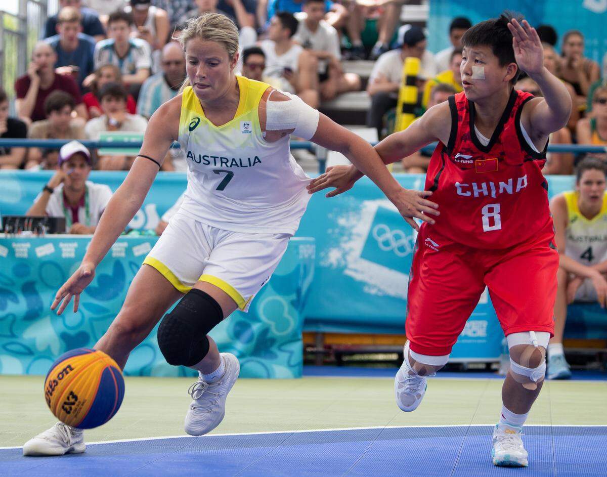 Oct 17, 2018; Buenos Aires, Argentina; Suzi-Rose Deegan (AUS) dribbles the ball as Rui Zhang (CHN) attempts to block during the Basketball 3x3 Women’s Bronze Medal Game at the Parque Mujeres Argentinas, Urban Park. The Youth Olympic Games, Buenos Aires, Argentina. Mandatory Credit: Gabriel Heusi for OIS/IOC Handout Photo via USA TODAY Sports