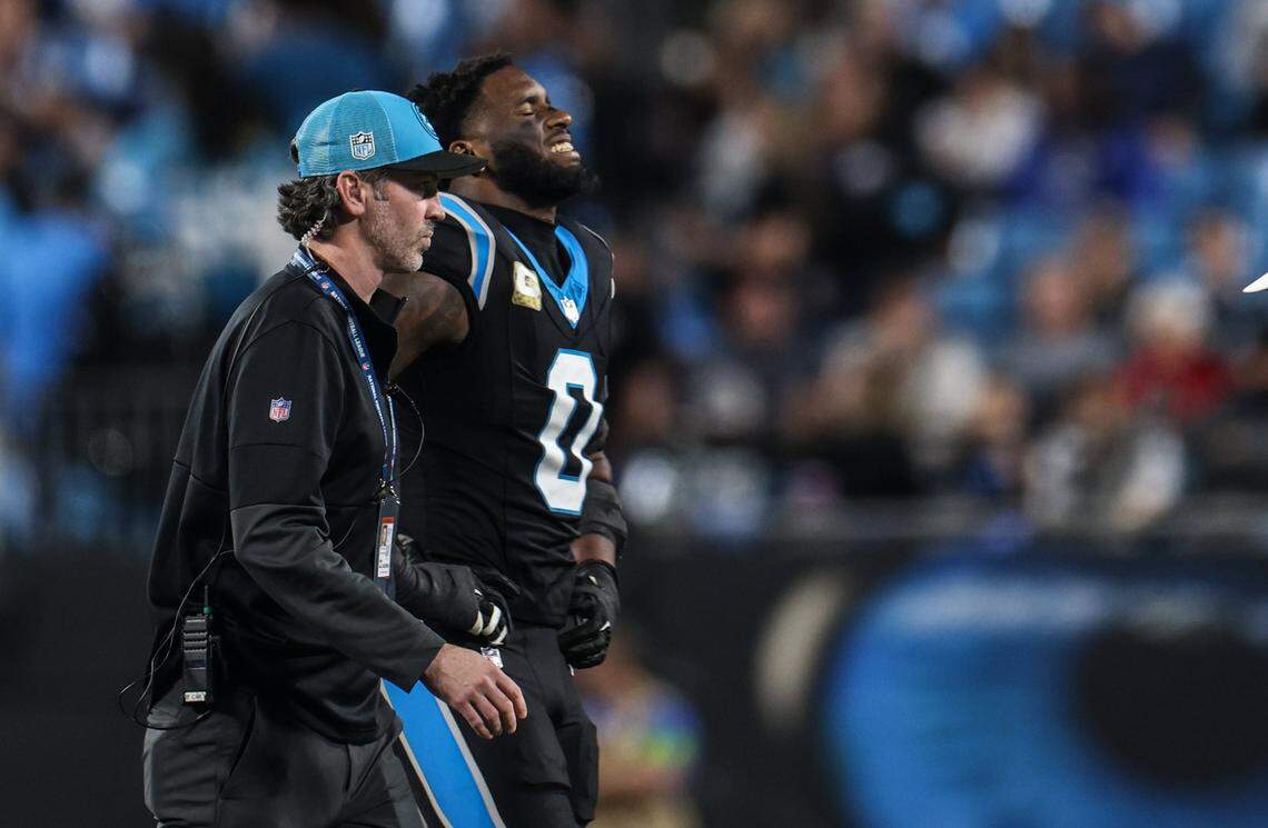Carolina Panthers linebacker Brian Burns winces as he walks off the field at the Bank of America Stadium in Charlotte, N.C., on Sunday, November 5, 2023.