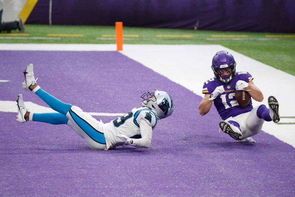 Minnesota Vikings wide receiver Chad Beebe catches a 10-yard touchdown pass over Carolina Panthers cornerback Corn Elder, left, during the second half of an NFL football game, Sunday, Nov. 29, 2020, in Minneapolis. The Vikings won 28-27. (AP Photo/Bruce Kluckhohn)