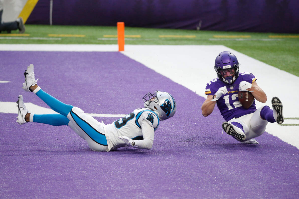 Minnesota Vikings wide receiver Chad Beebe catches a 10-yard touchdown pass over Carolina Panthers cornerback Corn Elder, left, during the second half of an NFL football game, Sunday, Nov. 29, 2020, in Minneapolis. The Vikings won 28-27. (AP Photo/Bruce Kluckhohn)