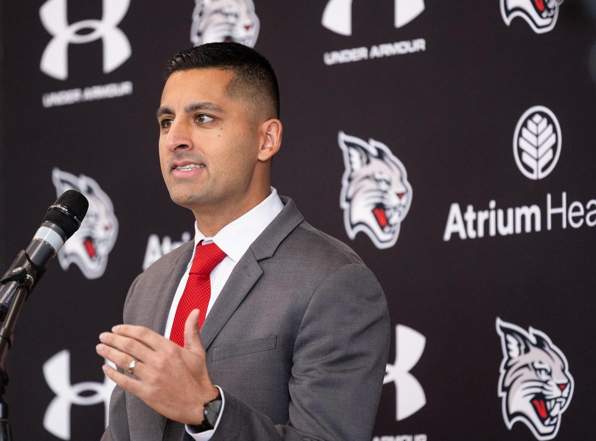 Saj Thakkar speaks after being introduced as the new football coach for Davidson College in Davidson, N.C., on Friday, December 20, 2024.