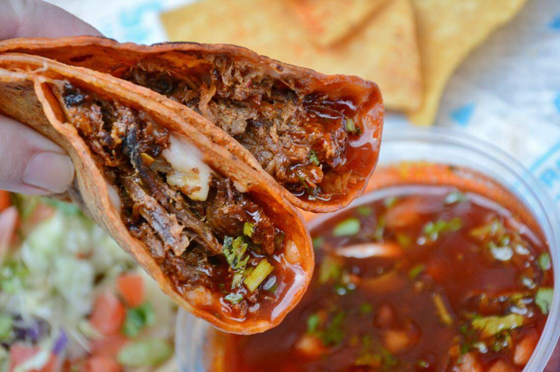 Sabor’s quesabirria are filled with barbacoa beef and shredded cheese, and served with a side of the consomme broth to dip them in.