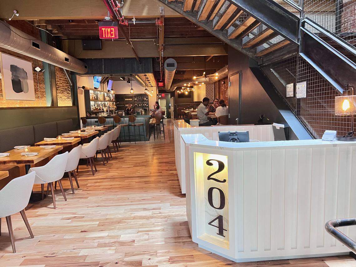 Design updates at 204 North Kitchen and Cocktails highlight exposed brick, beams and wood floors in the space.