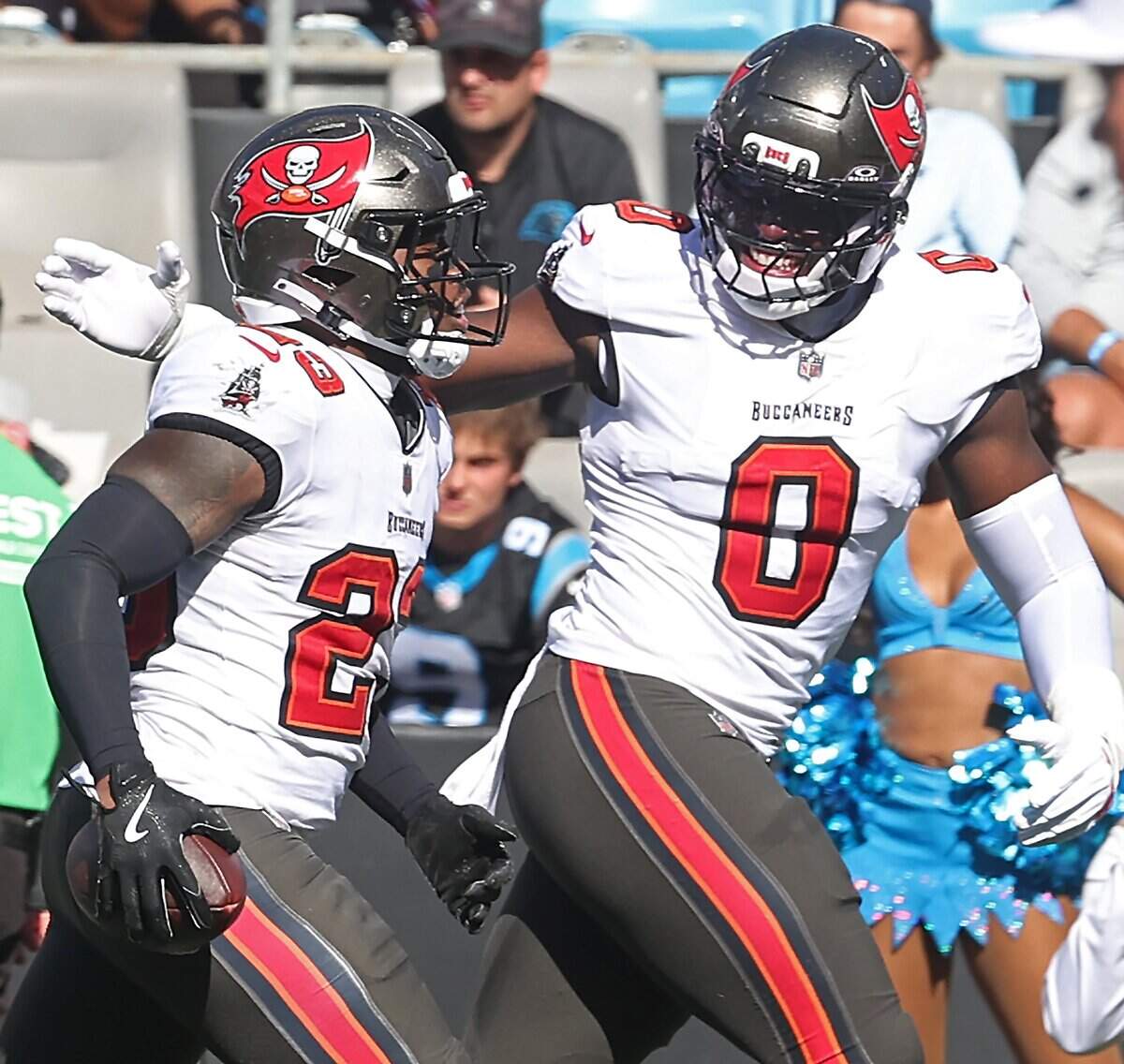 Tampa Bay Buccaneers safety Tykee Smith, left, is congratulated by linebacker Yaya Diaby, right, following Smith’s interception of a pass by Carolina Panthers quarterback Bryce Young during acton at Bank of America Stadium in Charlotte, NC on Sunday, October 25, 2026.