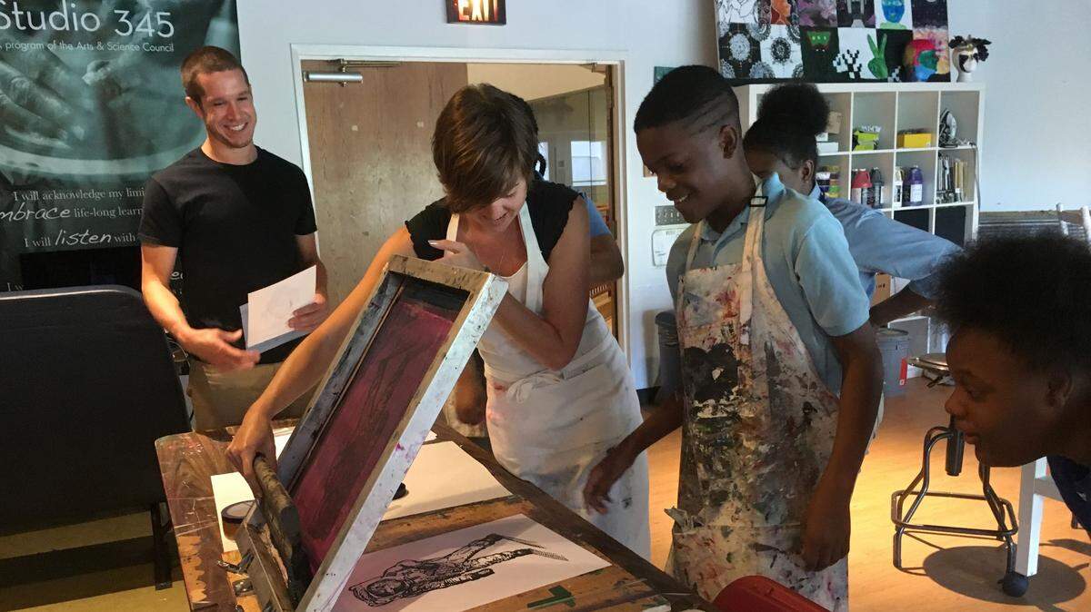 Students of the Arts & Science Council’s Studio 345 program learn a lesson in screenprinting. The Arts & Science Council designed the Studio 345 out-of-school program to encourage kids to stay in school and chase dreams beyond graduation while they study digital photography, digital media arts and multimedia design.