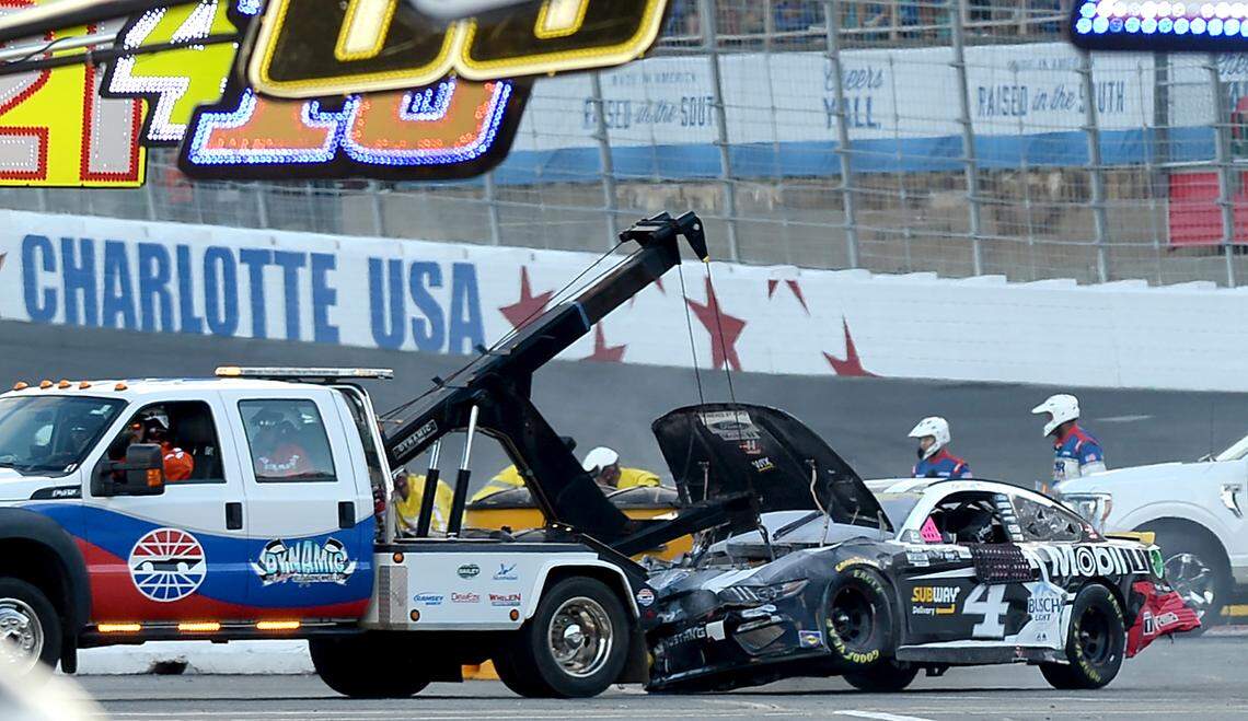 NASCAR driver Kevin HarvickÕs car his towed to the garage after he crashed heading into Turn 1 at Charlotte Motor Speedway during the Bank of America Roval 400 on Sunday, October 10, 2021.