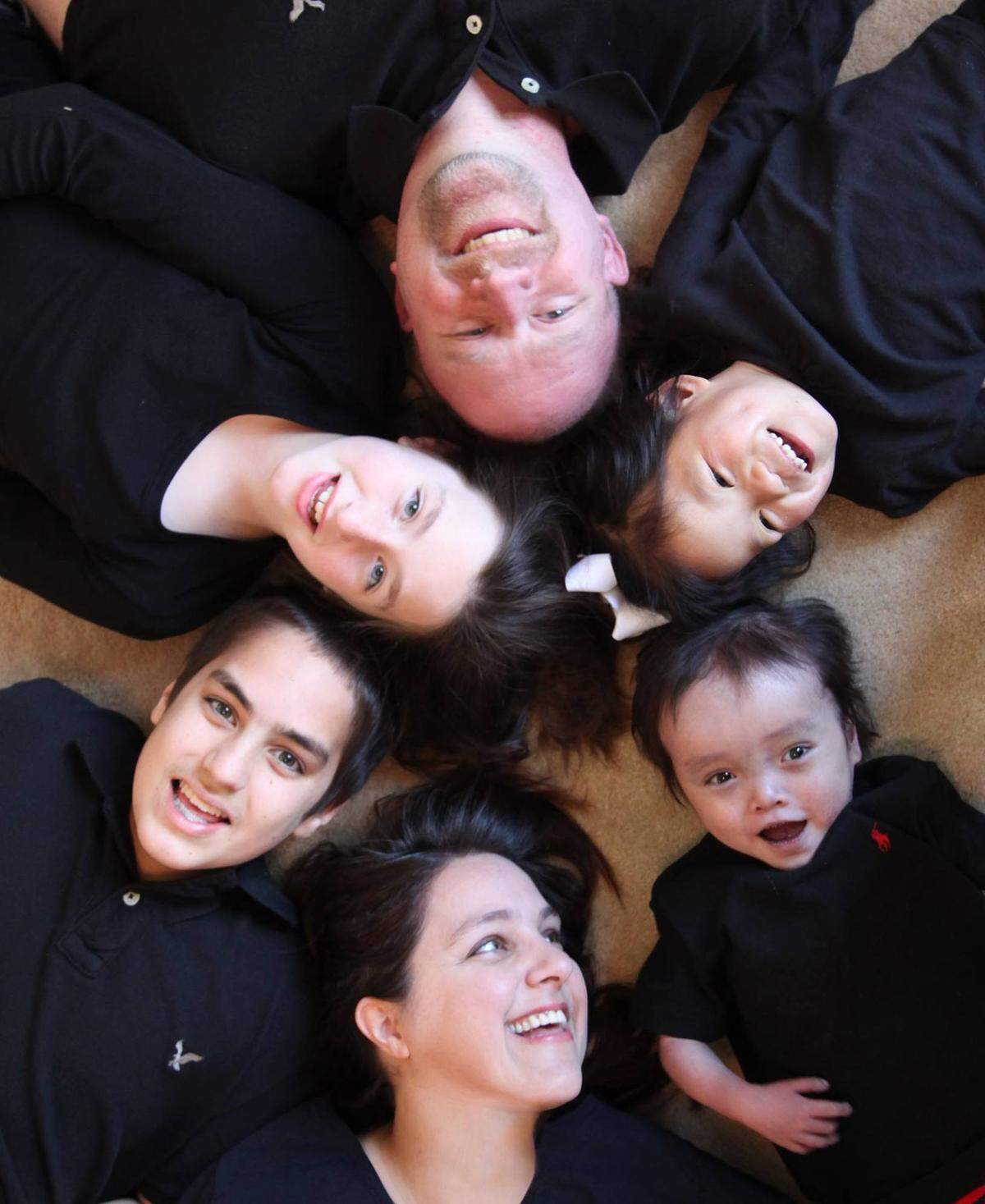 Braxton is at the bottom right of this photo taken with his family.