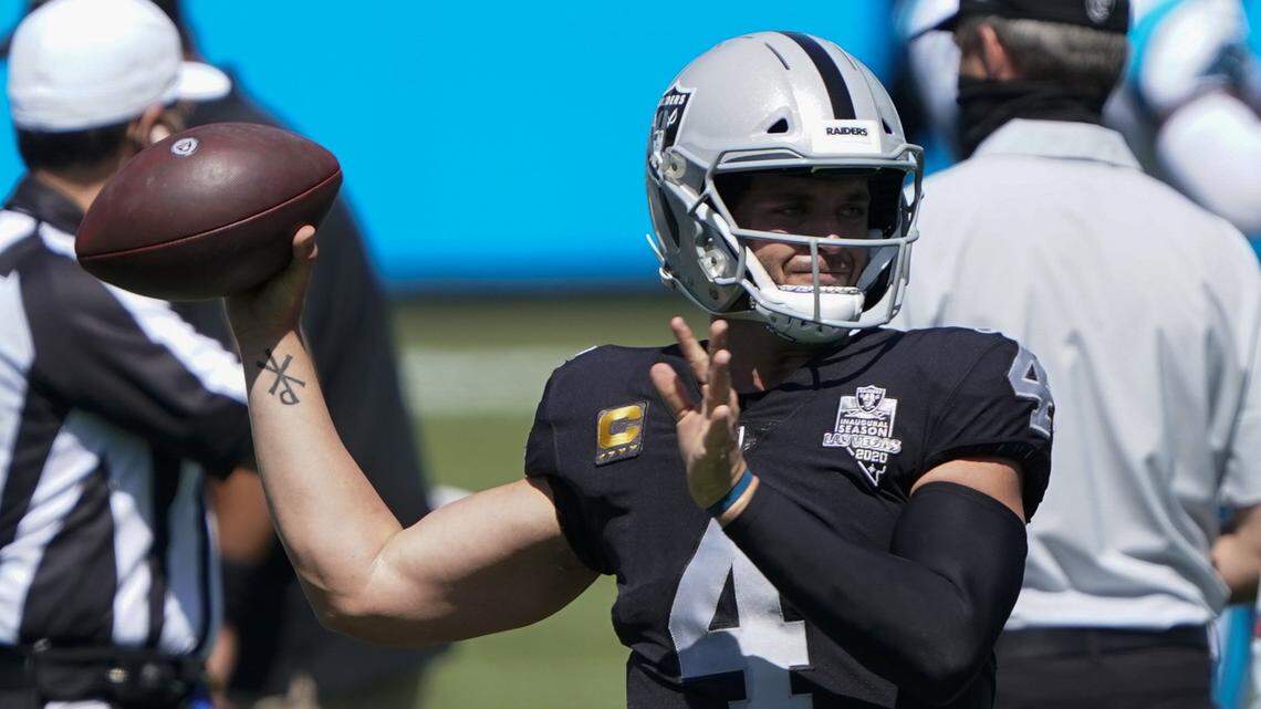 Las Vegas Raiders quarterback Derek Carr warms up before before an NFL football game against the Carolina Panthers Sunday, Sept. 13, 2020, in Charlotte, N.C. (AP Photo/Brian Blanco)