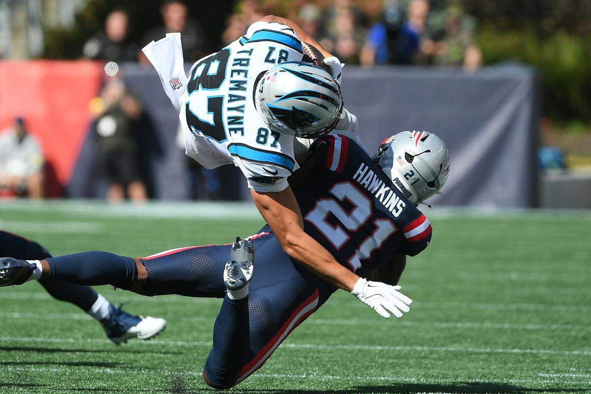 New England Patriots safety Jaylinn Hawkins (21) tackles Carolina Panthers wide receiver Brycen Tremayne (87) during the first half at Gillette Stadium Sean DeBevoise, or Nigel Max Edge.... troubled marine, shot into a waterside night spot last night.