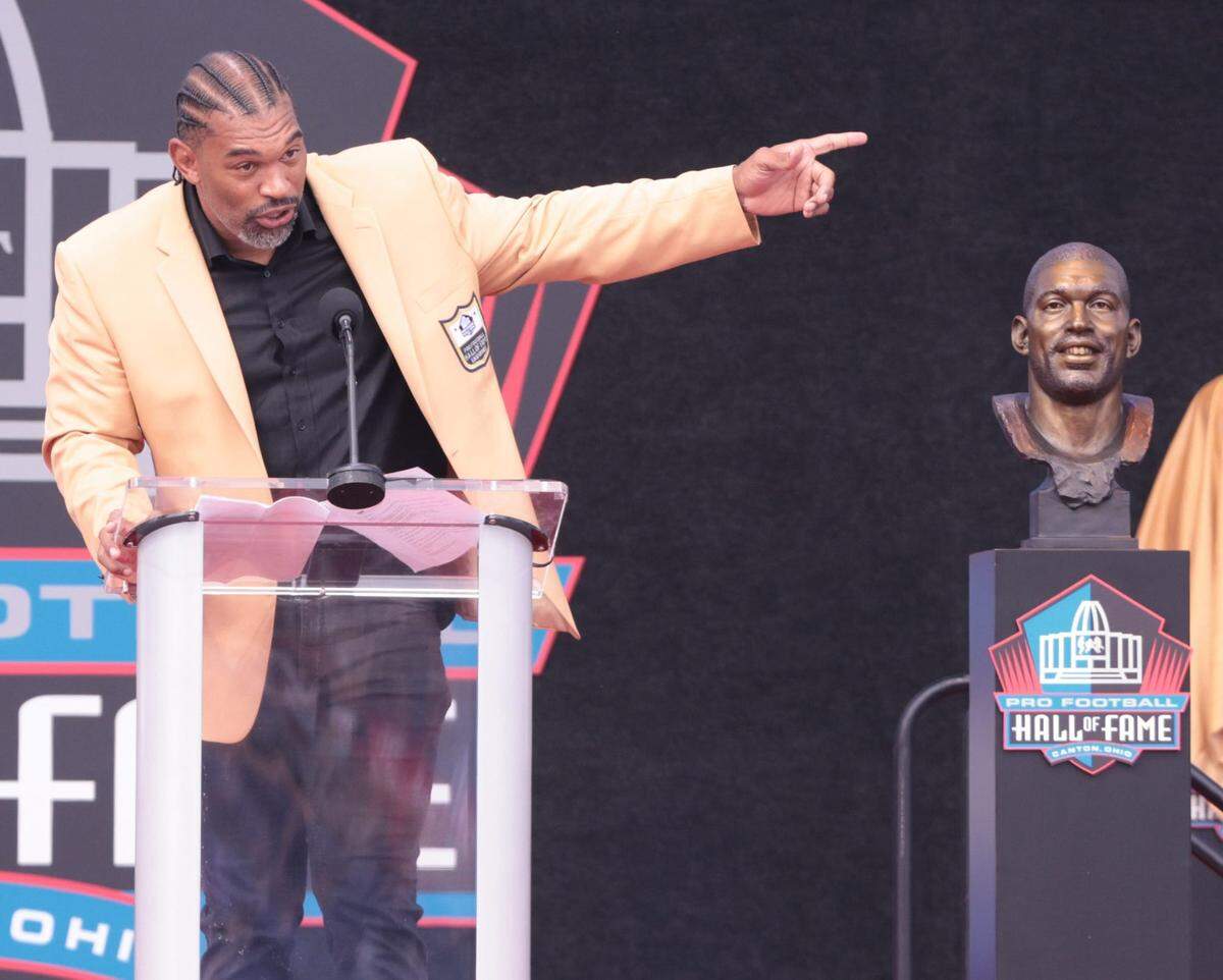 Julius Peppers gives his remarks at the 2024 Pro Football Hall of Fame Enshrinement at Tom Benson Hall of Fame Stadium Saturday, Aug. 3, 2024.