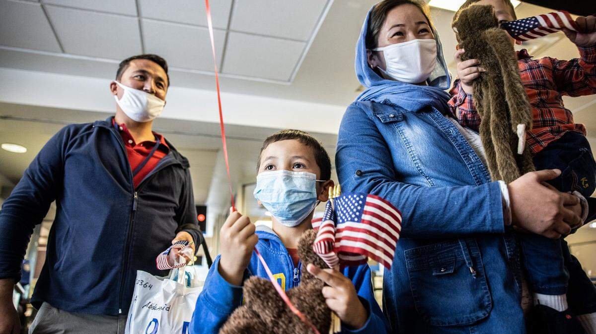 Hamid, left, and his family arrive at the Charlotte Douglas International Airport on Nov. 9, 2021. His work with U.S. Army made him a target of the Taliban’s in Afghanistan. North Carolina is now their new home.
