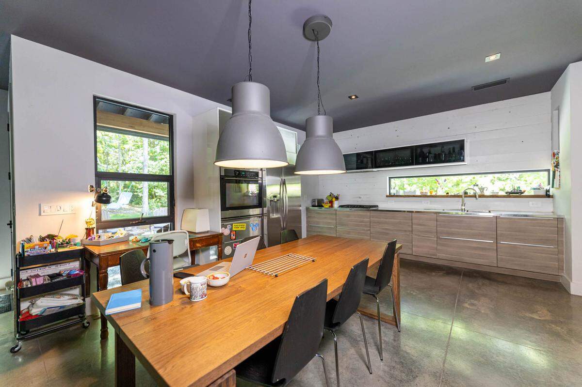 The kitchen in Toby Witte’s modern home includes a window that looks out to the street.
