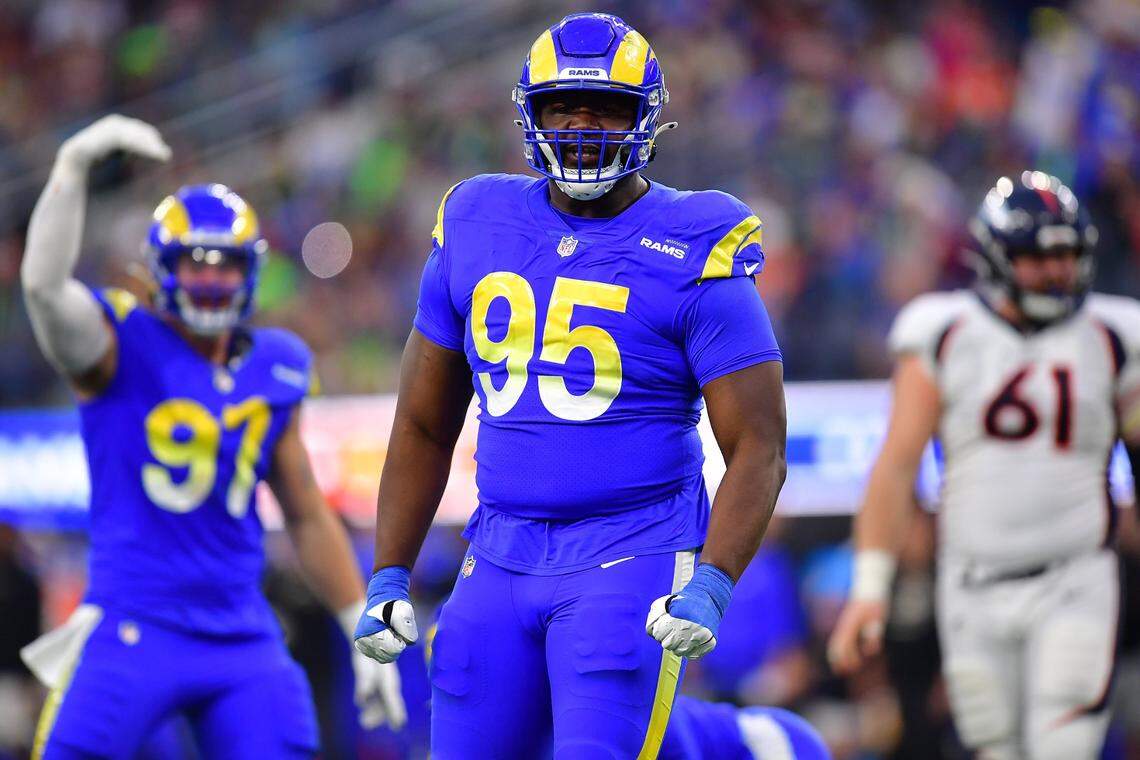 Dec 25, 2022; Inglewood, California, USA; Los Angeles Rams defensive tackle Bobby Brown III (95) reacts after a defensive play against the Denver Broncos during the second half at SoFi Stadium. Mandatory Credit: Gary A. Vasquez-USA TODAY Sports