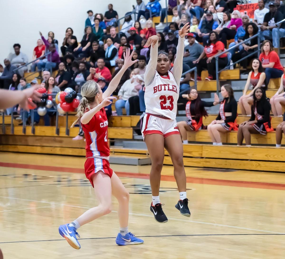 Brooklyn Saunders lets it fly and makes the three while being defended by Charlotte Catholics defense in the third quarter on February 7th, 2025 at Butler high school in Matthews, NC