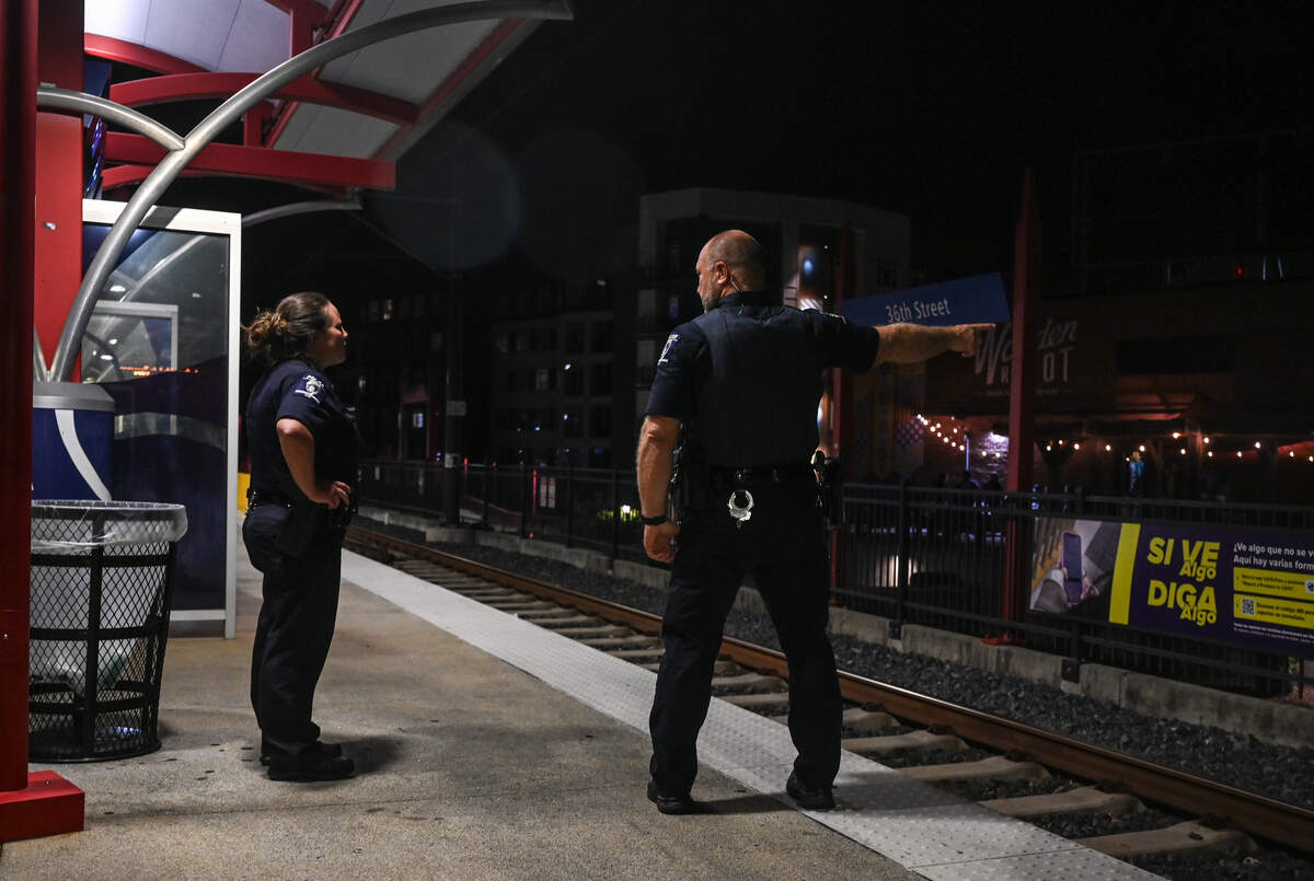 CMPD officers stand guard on the platform at the 36th Street stop of the blue line of the light rail in Charlotte on Thursday, August 20, 2026. Despite the fatal stabbing of Iryna Zarutska last year, many light rail riders have not decreased their use of the local transportation system. While some riders have said they rarely get checked for their light rail pass, they have also noticed an increase in the presence of security guards and CMPD officers.
