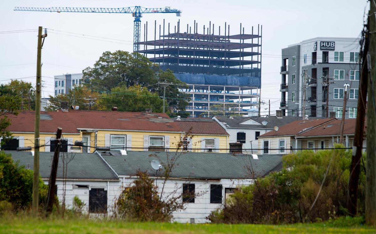 The Brookhill Neighborhood is seen with large construction projects less than a mile away in Charlotte, NC on Friday, October 9, 2020. Brookhill was built more than 50 years ago and has remained one of the last affordable housing options in South End.