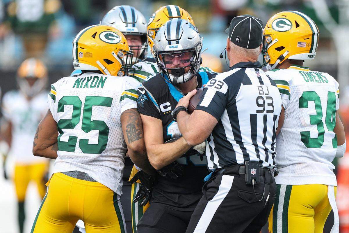 After making a catch, Carolina Panthers wide receiver Adam Thielen (19) rushes the ball to the refs as time the last few seconds burn off the clock during the game against the Packers at Bank of America Stadium on Sunday, December 24, 2023. Ultimately, the Panthers ran out of time to make a play and were defeated by the Packers, 33-30.