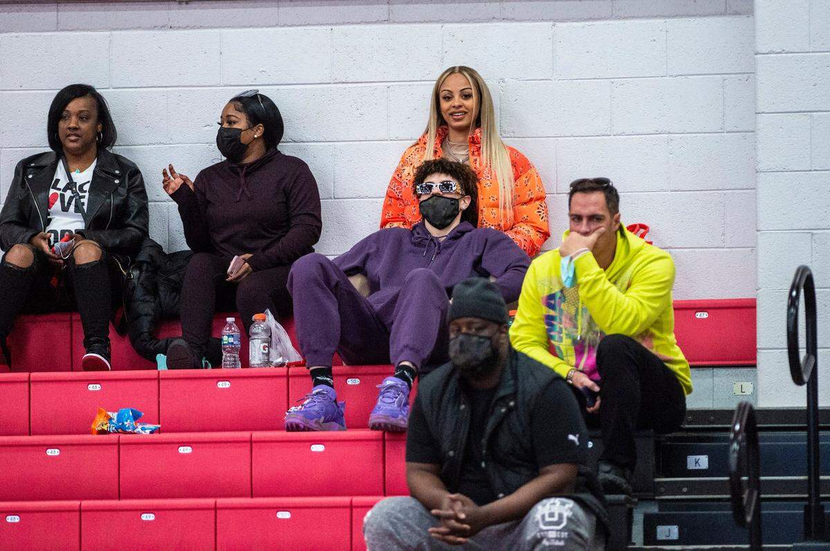 LaMelo Ball, center, watched some of Mikey Williams’ game for Vertical Academy Saturday in Charlotte. Ball took an unconventional path to the NBA, never playing in college.