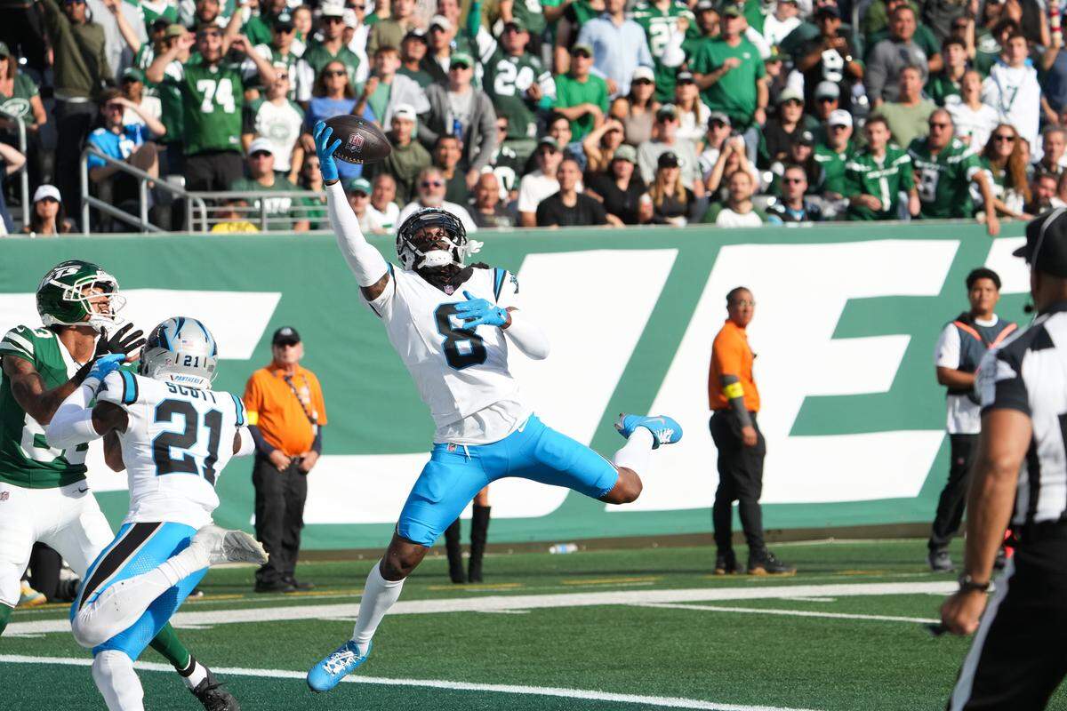 Carolina Panthers cornerback Jaycee Horn (8) intercepts a pass during Sunday’s third quarter against the New York Jets at MetLife Stadium. 