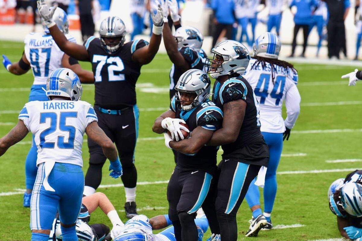 Panthers running back Mike Adams is supported by a teammate as he runs into the end zone for a touchdown against Detroit during 1st quarter action on Sunday, November 22, 2020.