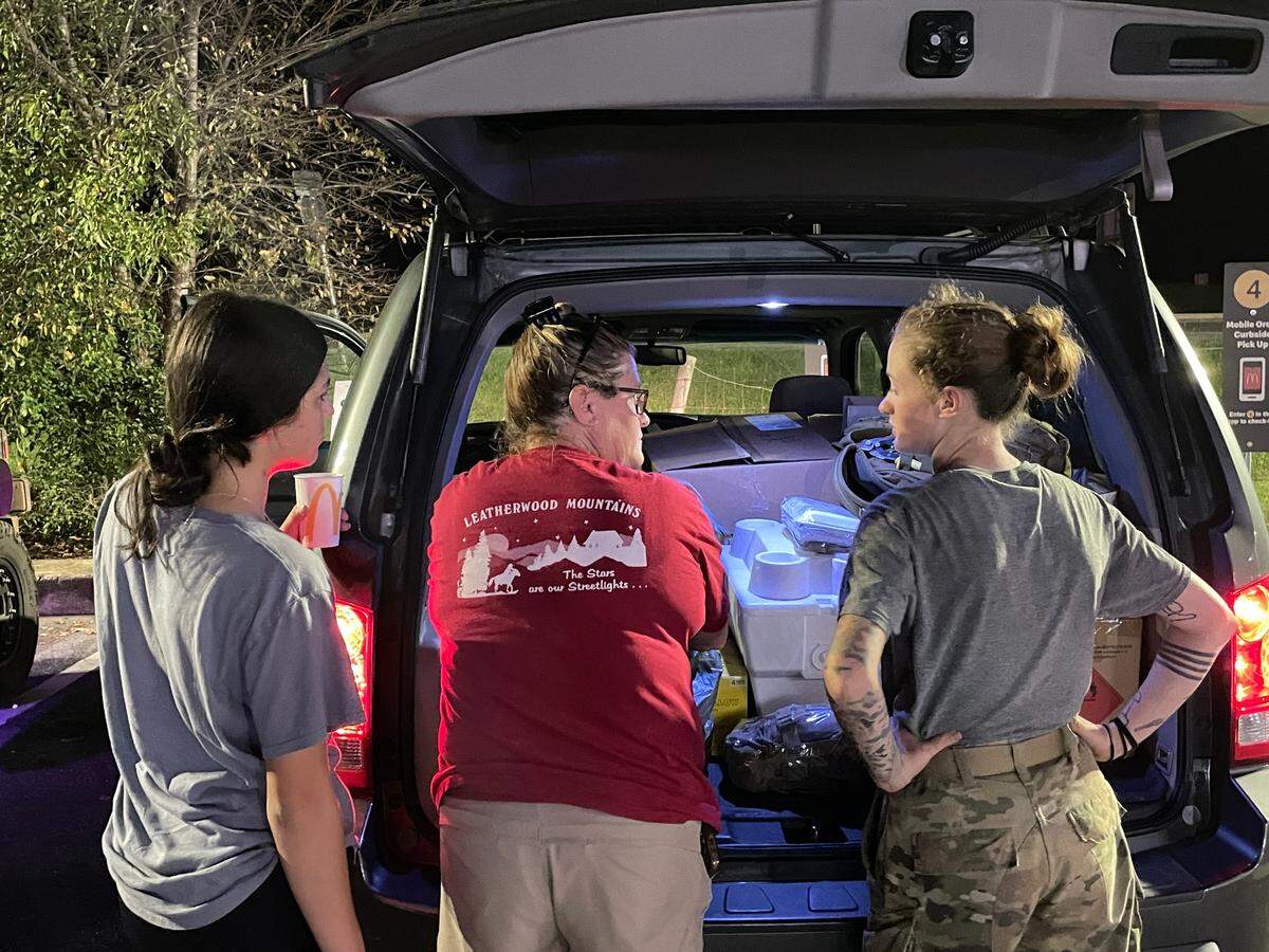 Jennifer Bowman stands between two of her daughters, Graci Silva, 16 (left), and Adysen McClain, 23 (right), before Adysen returns to the mountains of Western North Carolina. She’s on active duty with the U.S. Army, protecting fire departments from people trying to break in.