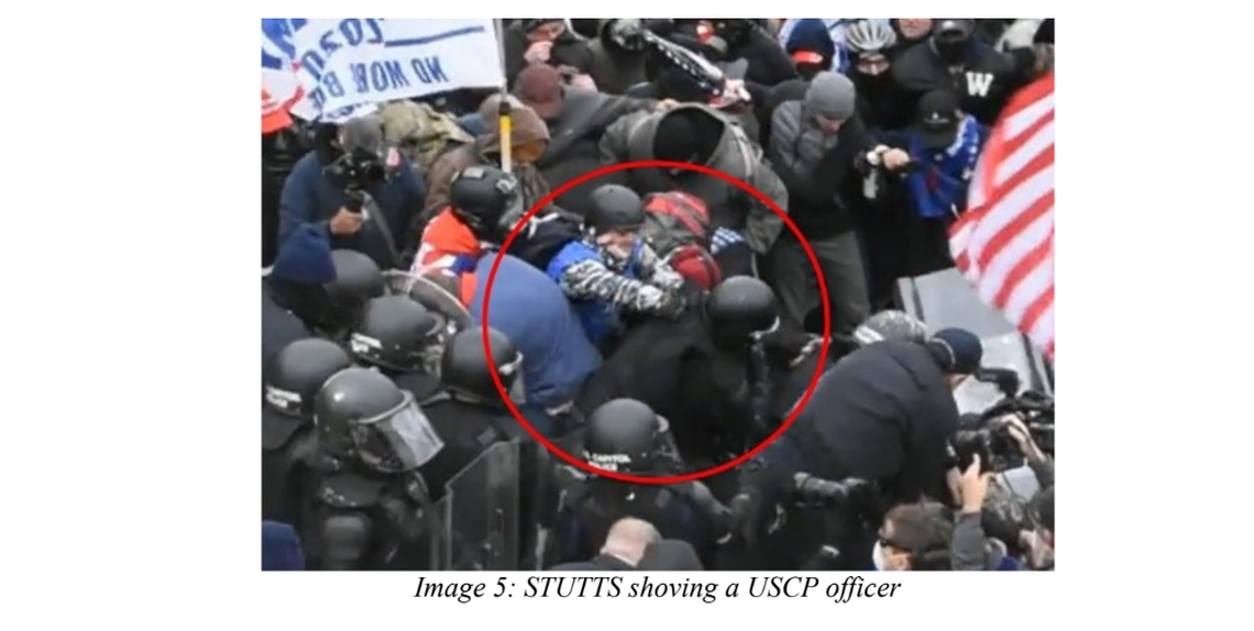 Lee Stutts shoves a U.S. Capitol Police officer in this image from closed-circuit police video included in a criminal indictment against Stutts.