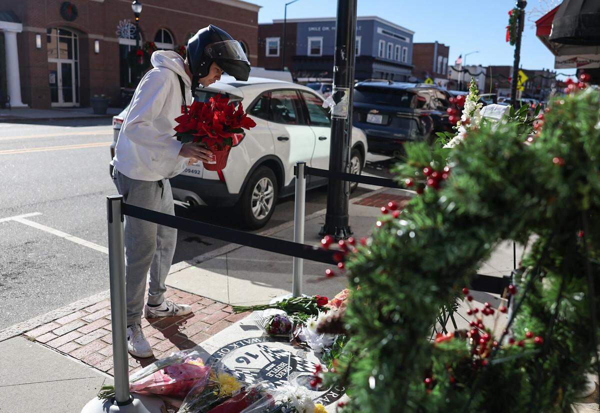 A fan visits Greg Biffle’s marker at the North Carolina Auto Racing Walk of Fame on Friday, Dec. 19, 2025.