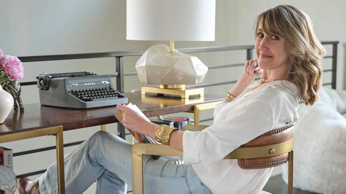 Kimmery Martin, shown in her Charlotte home, wrote a new medical novel, “Doctors and Friends.” Before COVID hit, she envisioned a coronavirus-like pandemic sweeping the nation.