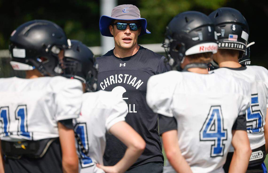 Former Carolina Panthers linebacker Luke Kuechly coaches players with Charlotte Christian middle school during football practice in 2024.