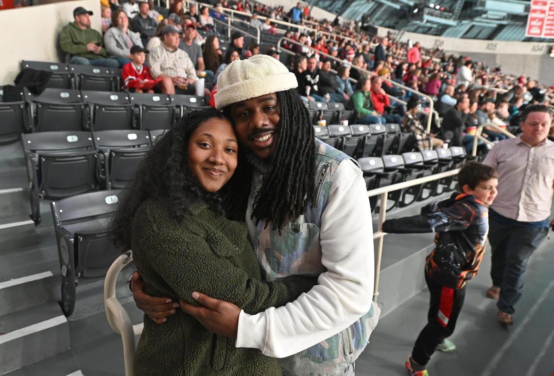 Charlotte Checkers fans Tytionna Bryant, left and Dashawn Godbolt, right, became engaged at the Checkers season opener against the Cleveland Monsters at Bojangles Coliseum in Charlotte, NC on Friday, October 18, 2024. Godbolt proposed to Bryant during a break in the action to the cheers and congratulations of fans.