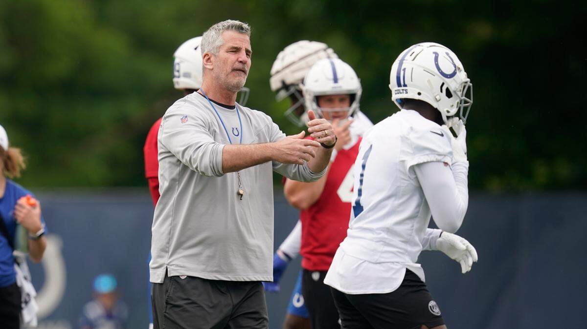 Indianapolis Colts head coach Frank Reich talks with Parris Campbell during a practice at the NFL football team’s training facility, Wednesday, June 8, 2022, in Indianapolis. (AP Photo/Darron Cummings)
