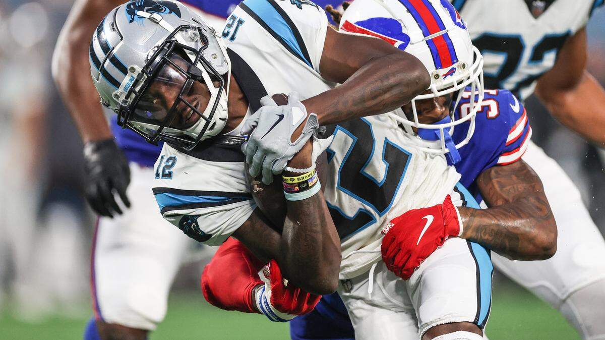 Panthers wide receiver Shi Smith fights to hold onto the ball during the game against the Bills at Bank of America Stadium on Friday, August 26, 2022 in Charlotte, NC.