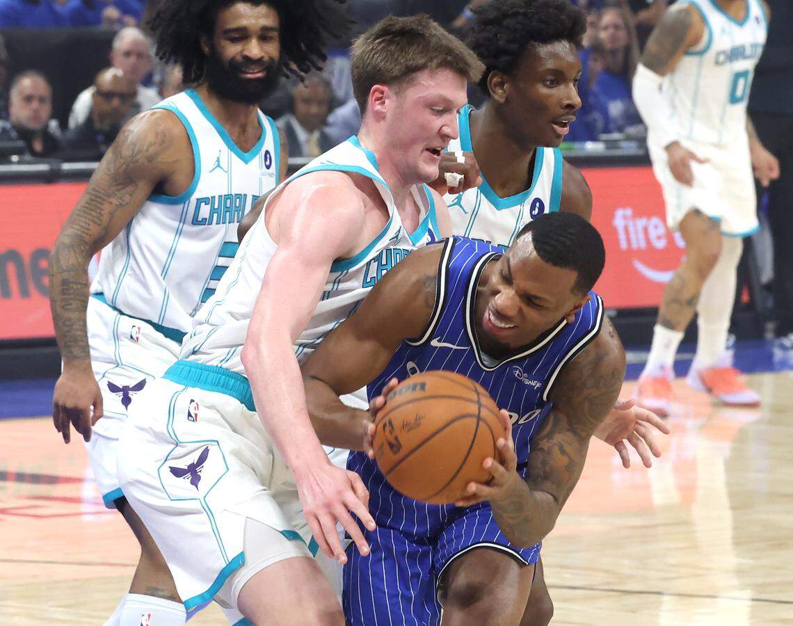 Charlotte Hornets forward Kon Knueppel, left, applies defensive pressure on Orlando Magic forward Jamal Cain, right, during action at Kia Center in Orlando, FL on Friday, April 17, 2026.