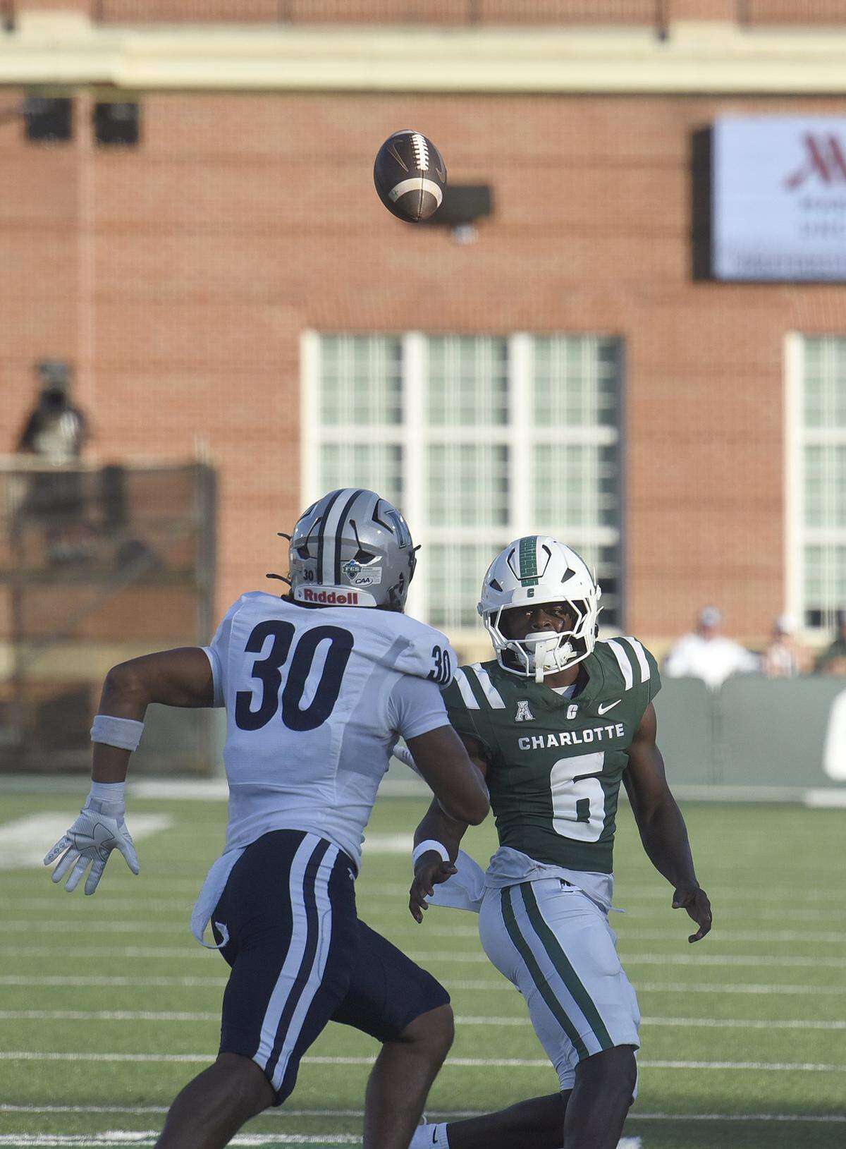 A pitch from Charlotte quarterback Conner Harrell sails high over the head teammate Rod Gainey, Jr. Monmouth's Jaeden Jones (30) recovered the ball.