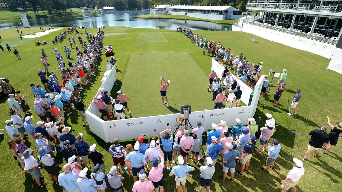 Fans gather around the 14th tee box during a practice round at Quail Hollow Club in Charlotte, NC on Tuesday, September 20, 2022. The U.S. team will face the International team in the Presidents Cup that will be held at Quail Hollow Club from September 22-25, 2022.