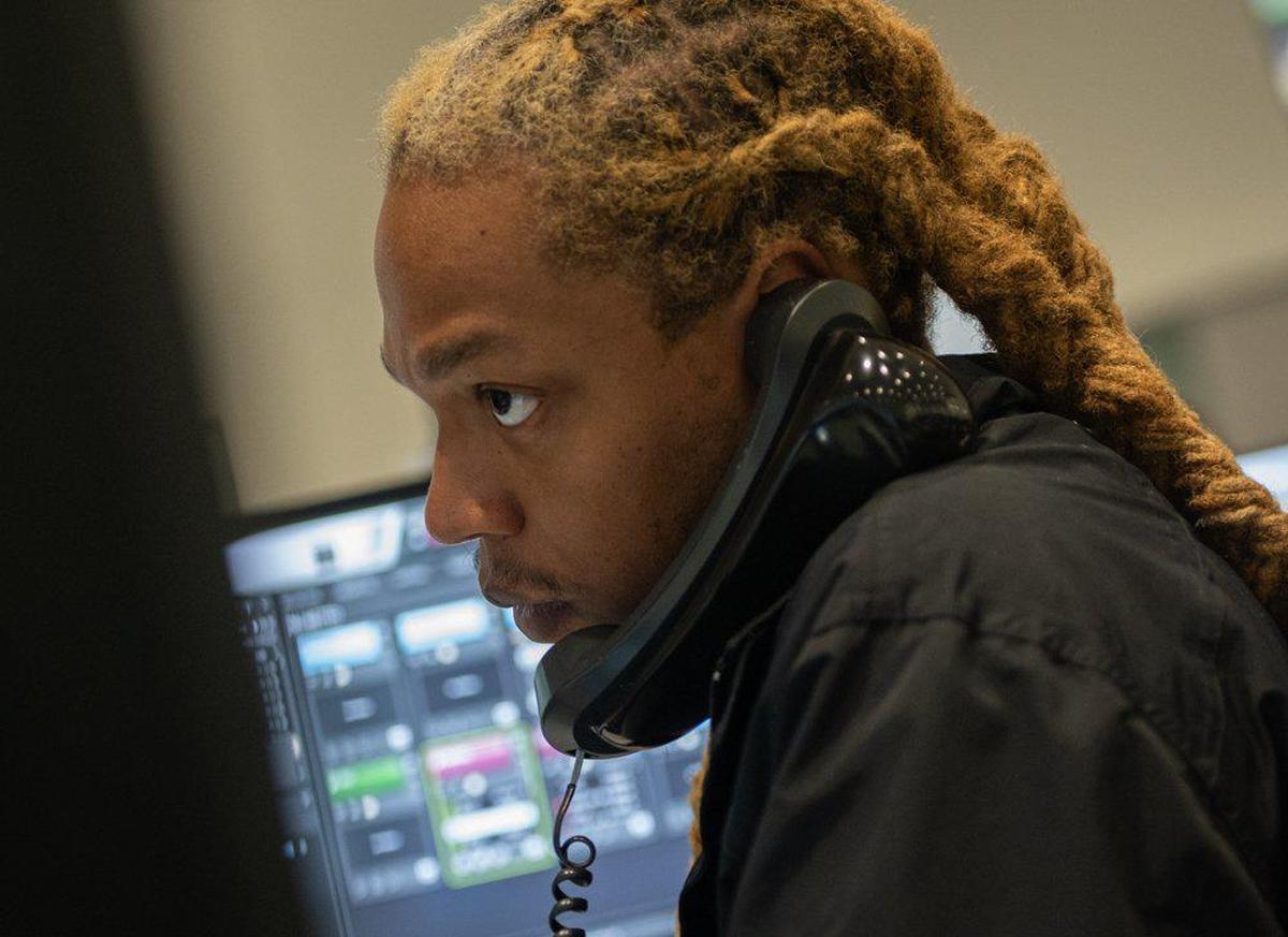 Justin Huntley fields calls from customers and teams of technicians at Duke Energy’s Charlotte Distribution Control Center.