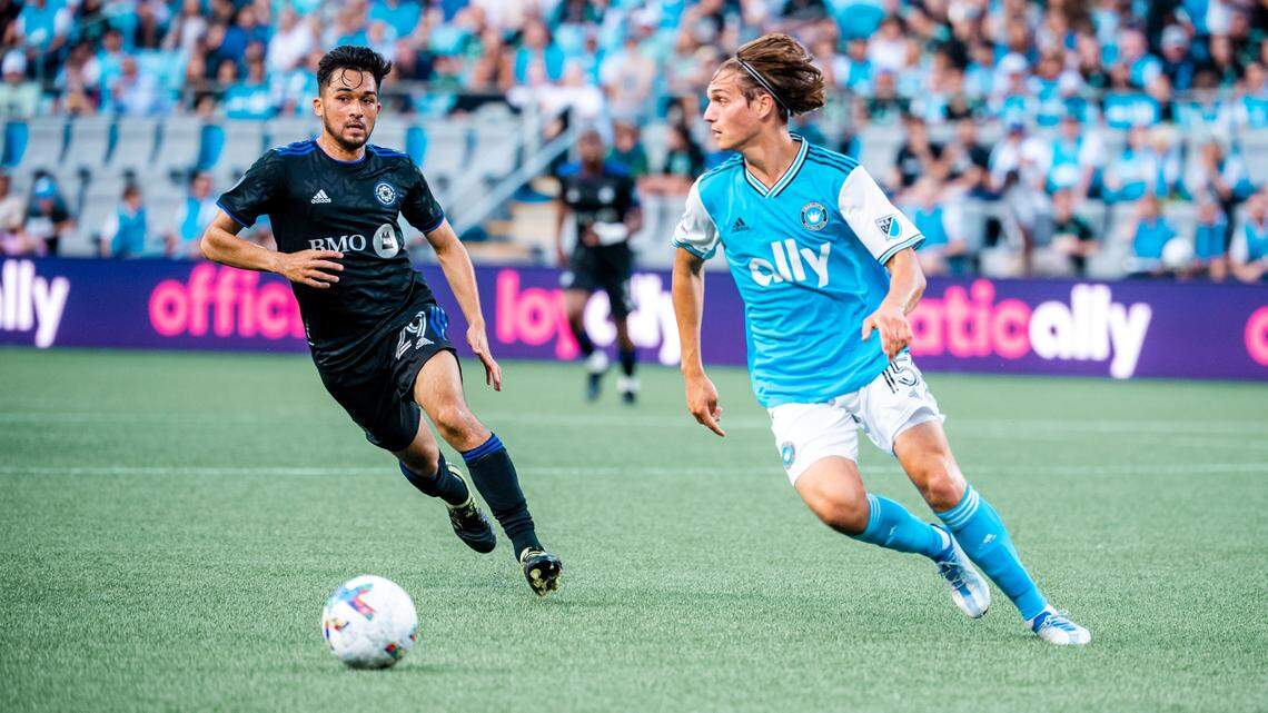 Charlotte FC midfielder Ben Bender plays a ball with a Montréal defender incoming Saturday, May 14 at Bank of America Stadium.