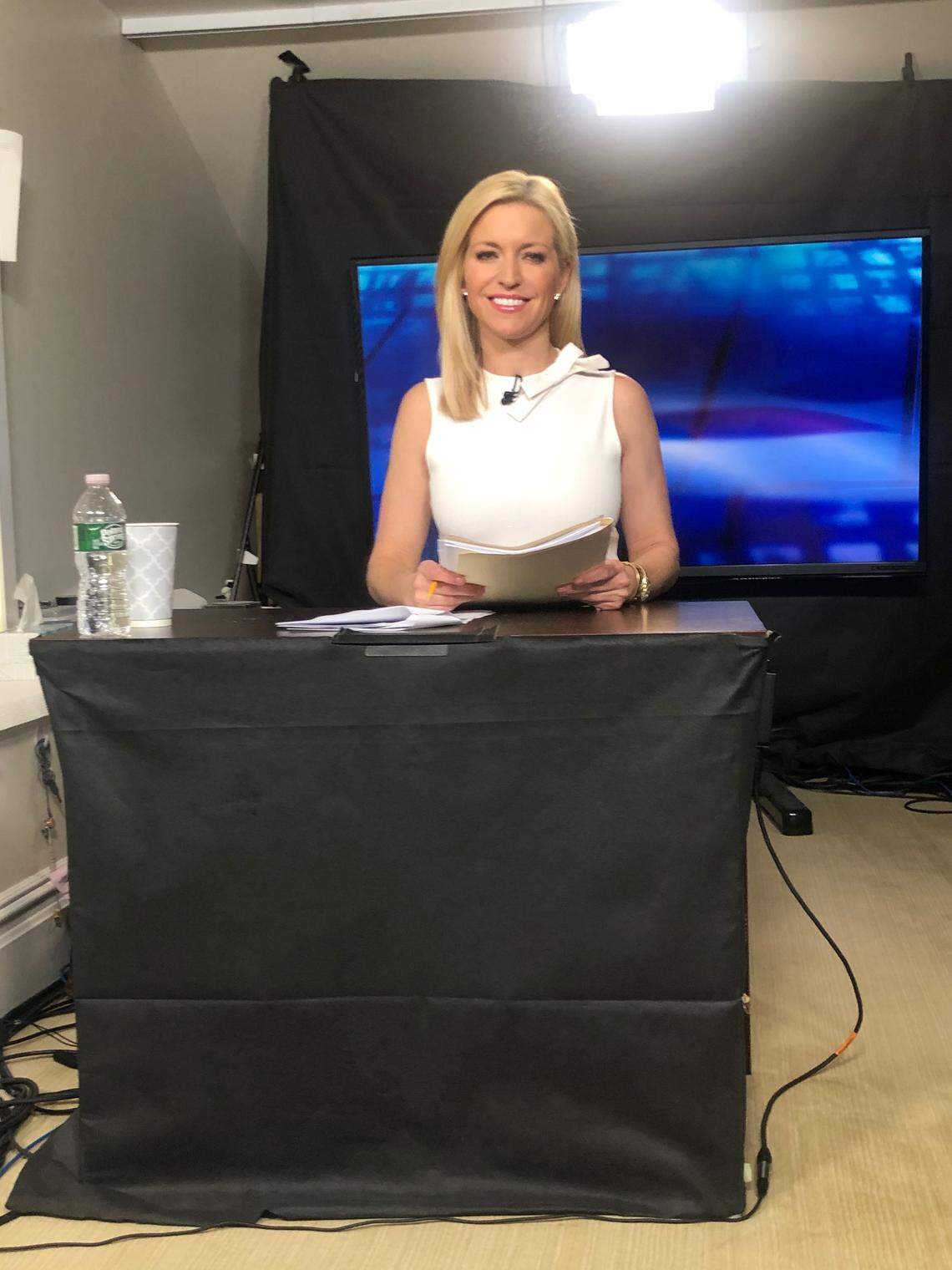 Ainsley Earhardt on the makeshift satellite set of “Fox & Friends.” She hasn’t been in the regular studio in Manhattan in five weeks.
