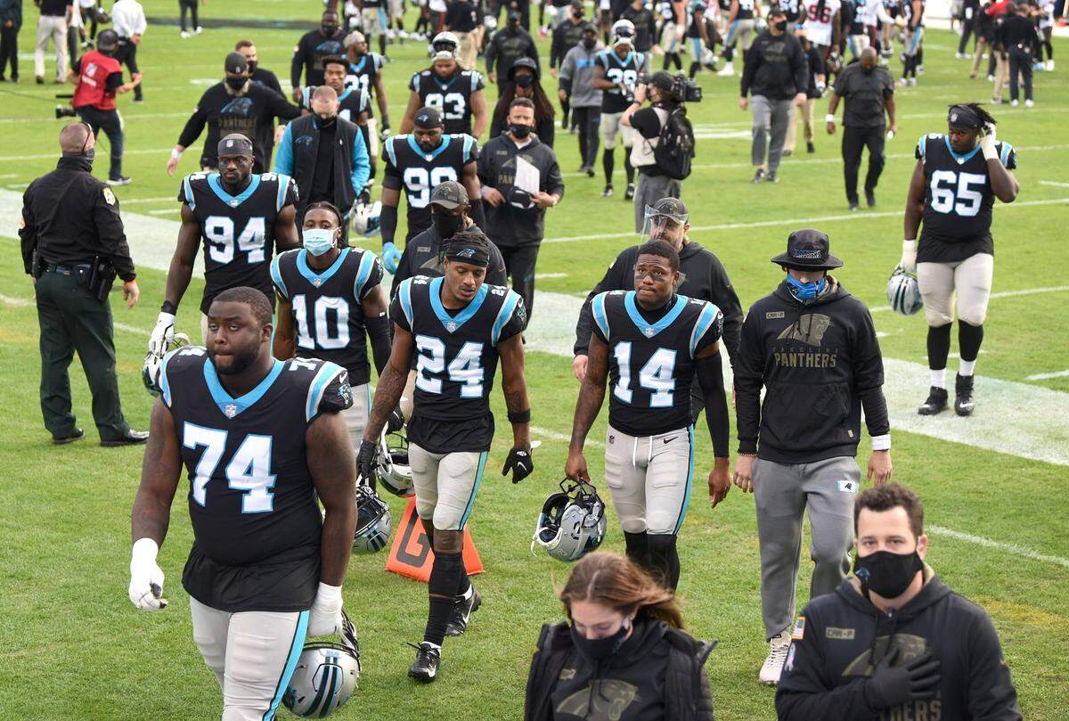The Carolina Panthers walk off the field dejected following their 46-23 loss to the Tampa Bay Buccaneers at Bank of America Stadium in Charlotte, NC on Sunday, November 15, 2020.