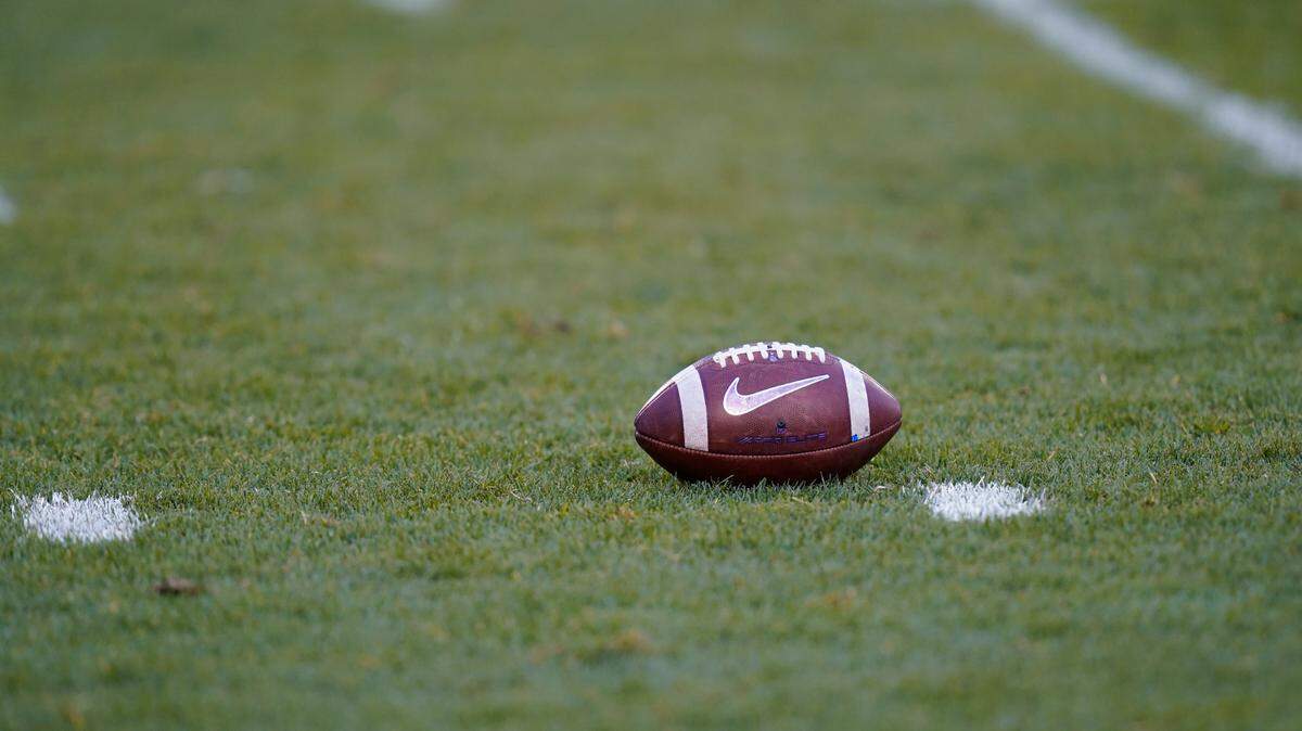 A ball sits on the field during the first half of an NCAA college football game between Iowa State and Kansas State, Saturday, Nov. 21, 2020, in Ames, Iowa. (AP Photo/Charlie Neibergall)