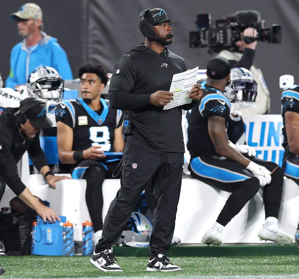 Carolina Panthers offensive coordinator Thomas Brown, center/right, stands along the team’s sideline following a failed series against the Indianapolis Colts during fourth-quarter action on Sunday, November 5, 2023 at Bank of America Stadium in Charlotte, NC. The Colts defeated the Panthers 27-13.