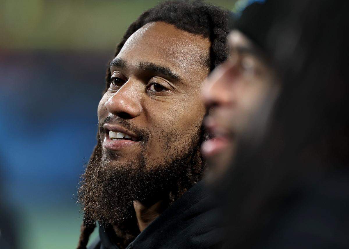 Injured Carolina Panthers linebacker Shaq Thompson stands along the team’s sideline against the Tampa Bay Buccaneers on Dec. 1, 2024. 