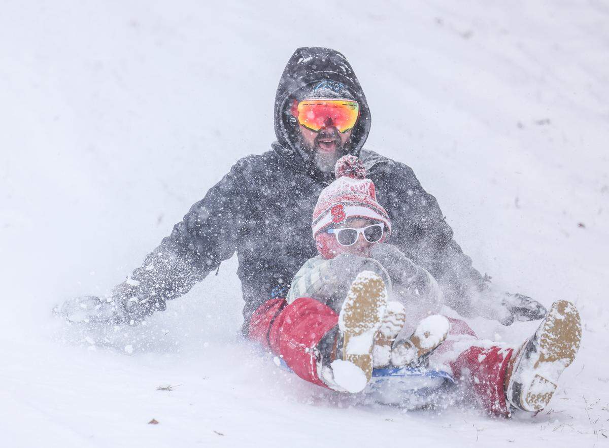 People sled in Cordelia Park in Charlotte, N.C., on Saturday, January 31, 2026.